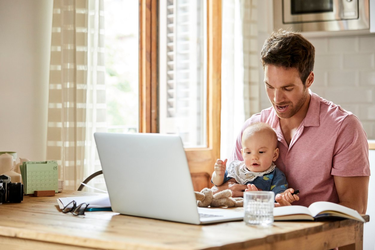 man with child at computer