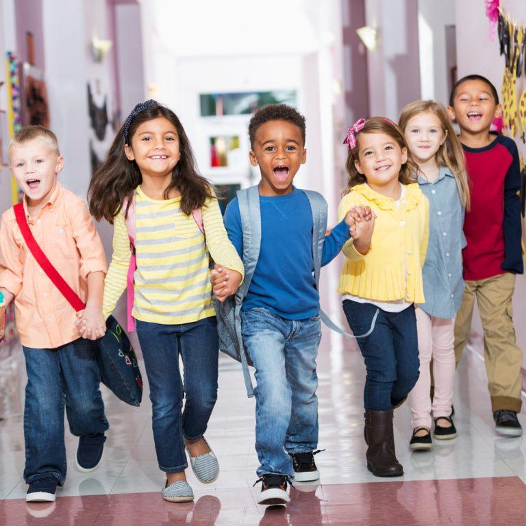 Kids in school hallway, back to school.