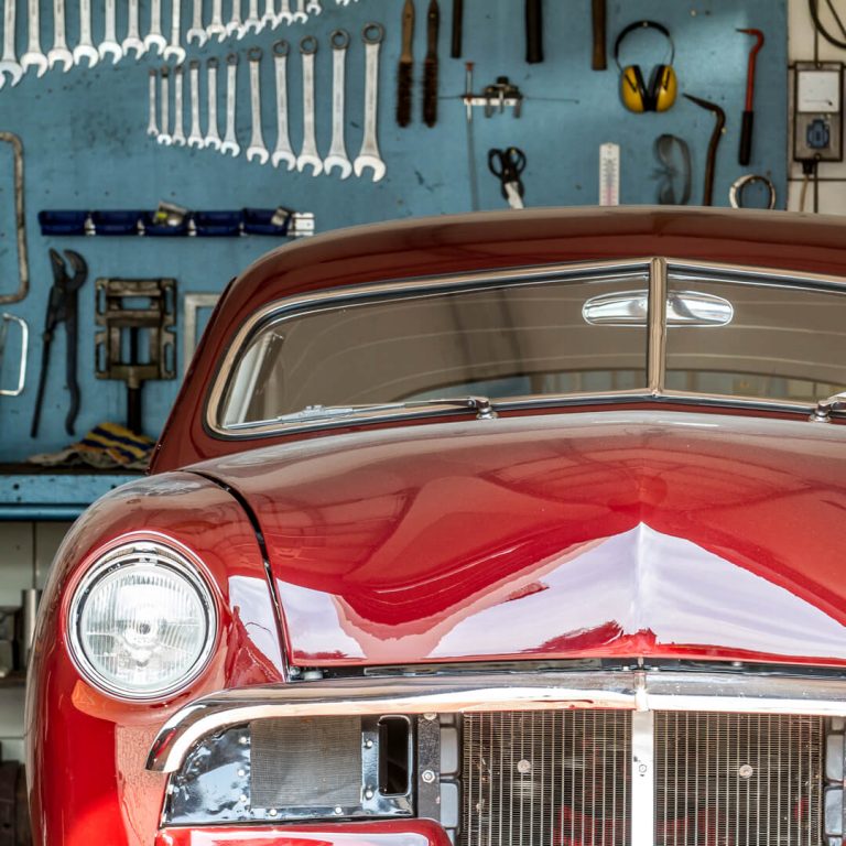 Classic Car parked in a garage.