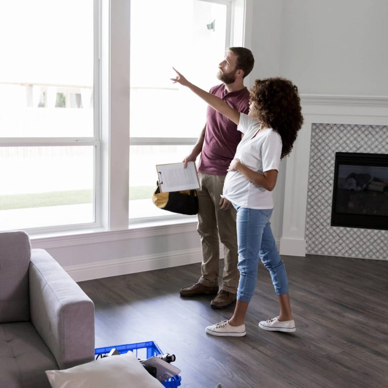 Expectant woman discussing upcoming renovations with a contractor.