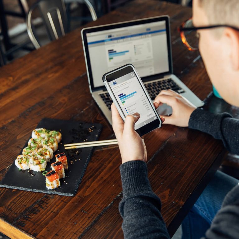 Man overlooks his budget while dining out.