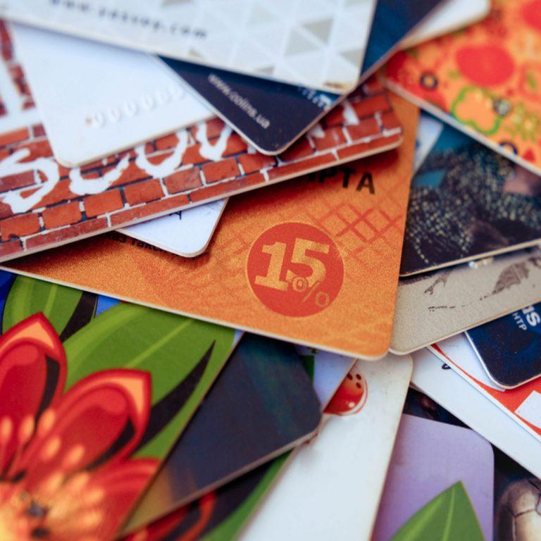 Stack of gift cards on a table from various vendors.