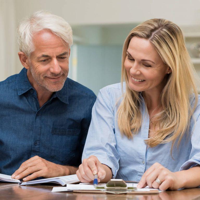 Retired couple creating their budget.