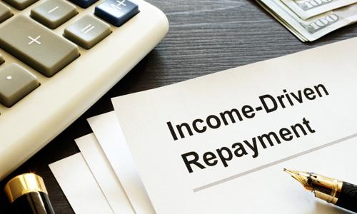 Income Driven Repayment Form on table next to a calculator