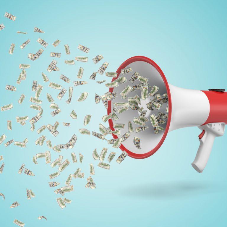 Loud Budgeting Concept: Megaphone with Dollar Bills Coming Out