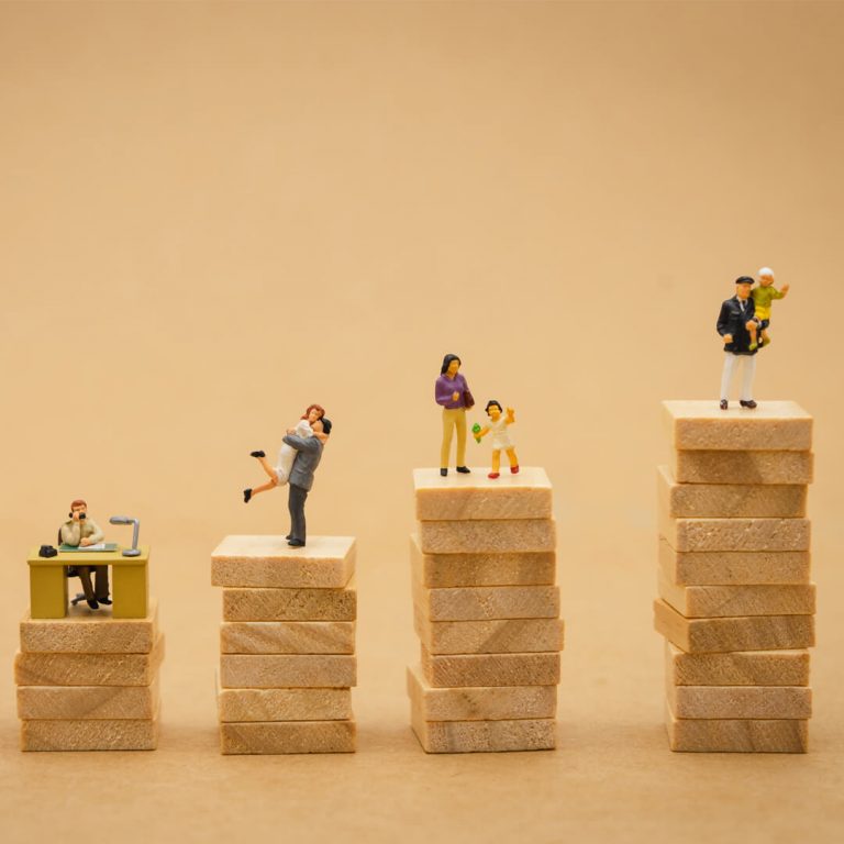 Figurines depicting couples at different life stages.