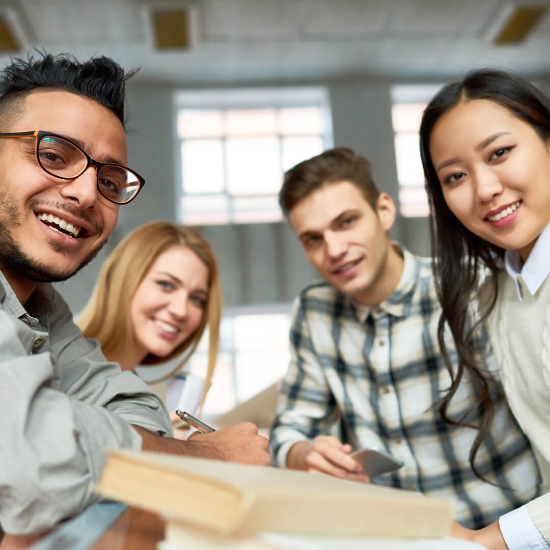 Group of students smiling at camera.
