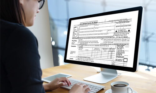 Woman filing her taxes online.