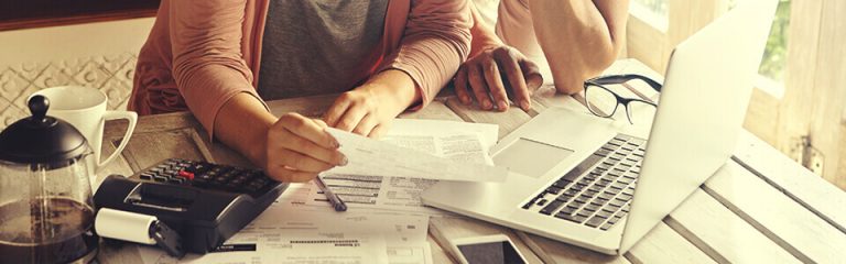 Serious couple going over their finances and debt consolidation options.