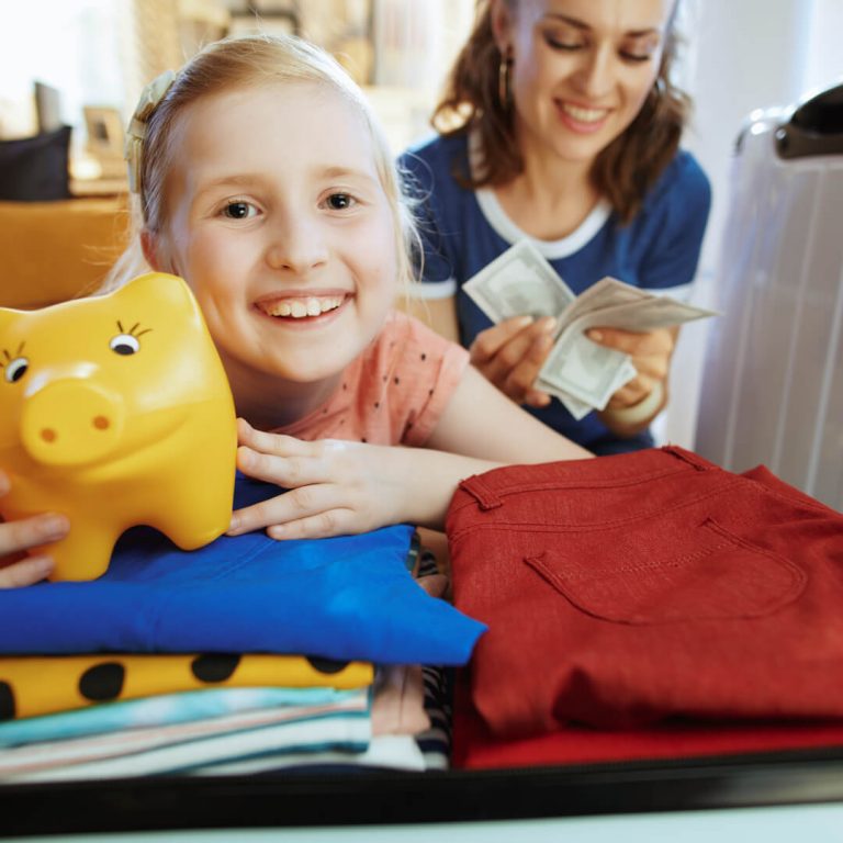 Daughter packing for a trip, mother in background with money in hand, illustrating savings.