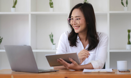 Woman looking at her savings account on her computer.