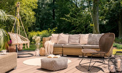 Beautiful outdoor furniture on backyard patio.