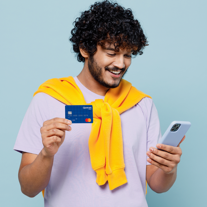 Man holding Quorum debit card