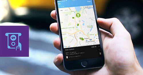 Closeup of hand holding mobile device displaying Quorum's ATM Finder.