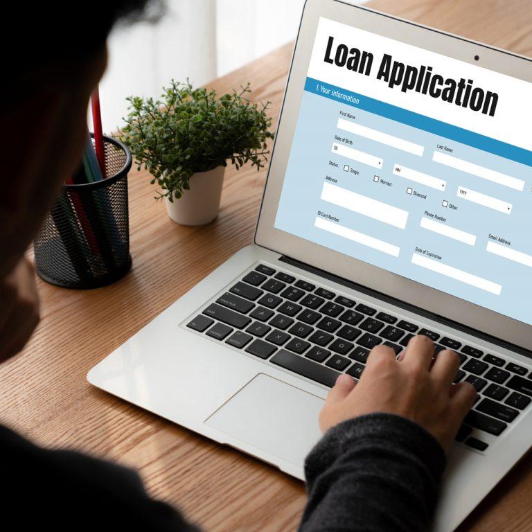 Laptop screen showing the beginning of a loan application.