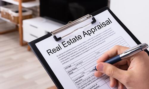 Clipboard showing a real estate appraisal.