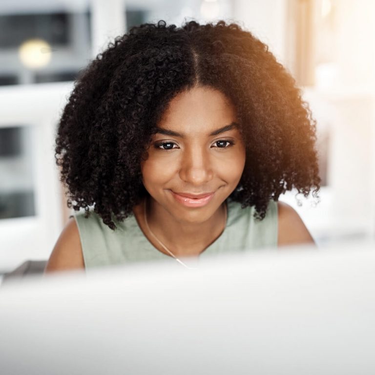 Smiling, confident woman browsing internet safely and securely.