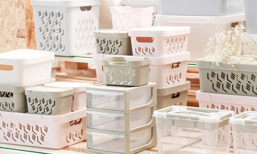 Storage bins (a great deal in August) stacked up in a department store.