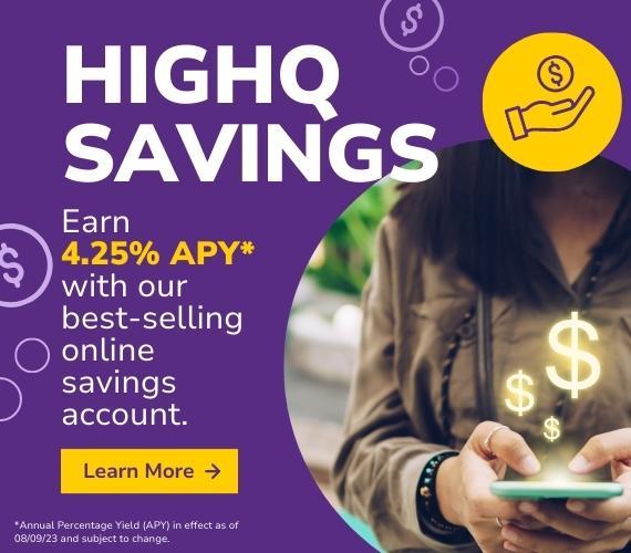 A woman eagerly checks her cell phone for her HighQ savings balance.