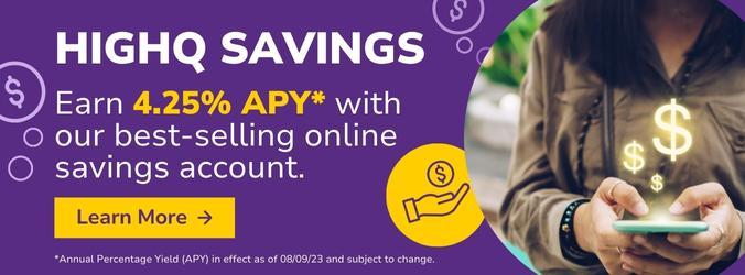 A woman eagerly checks her cell phone for her HighQ savings balance.
