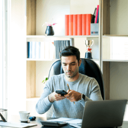 Young Professional Checking Phone
